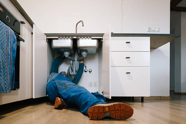 Professional Emergency Plumber technician working in Oswego, NY